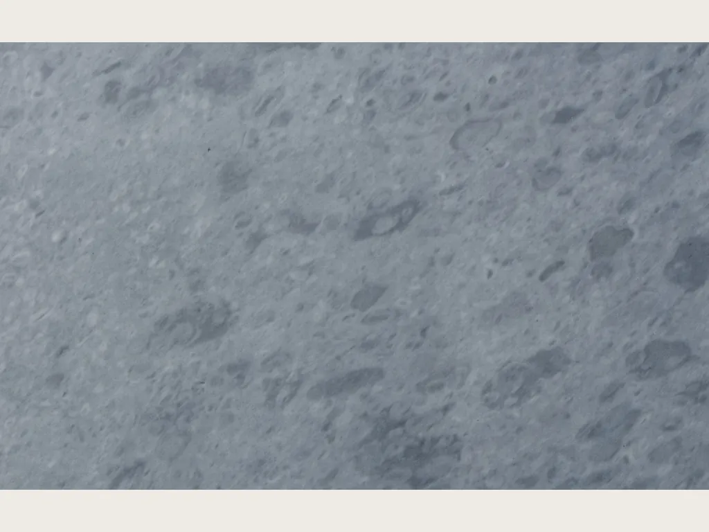 Slab of gray Bardiglio Imperiale marble: even blue-gray with round spots slightly darker