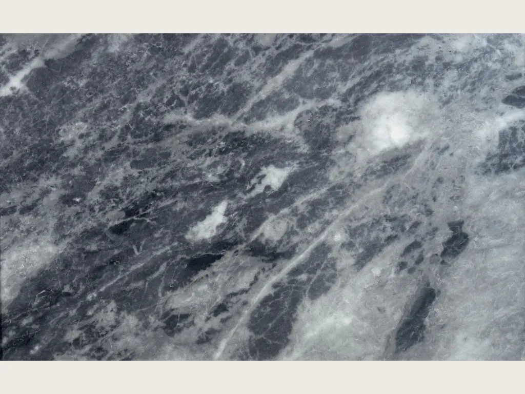Slab of gray Bardiglio Nuvolato marble: dark blue-gray background with grayish white clouds and veins in diagonal, polished finish