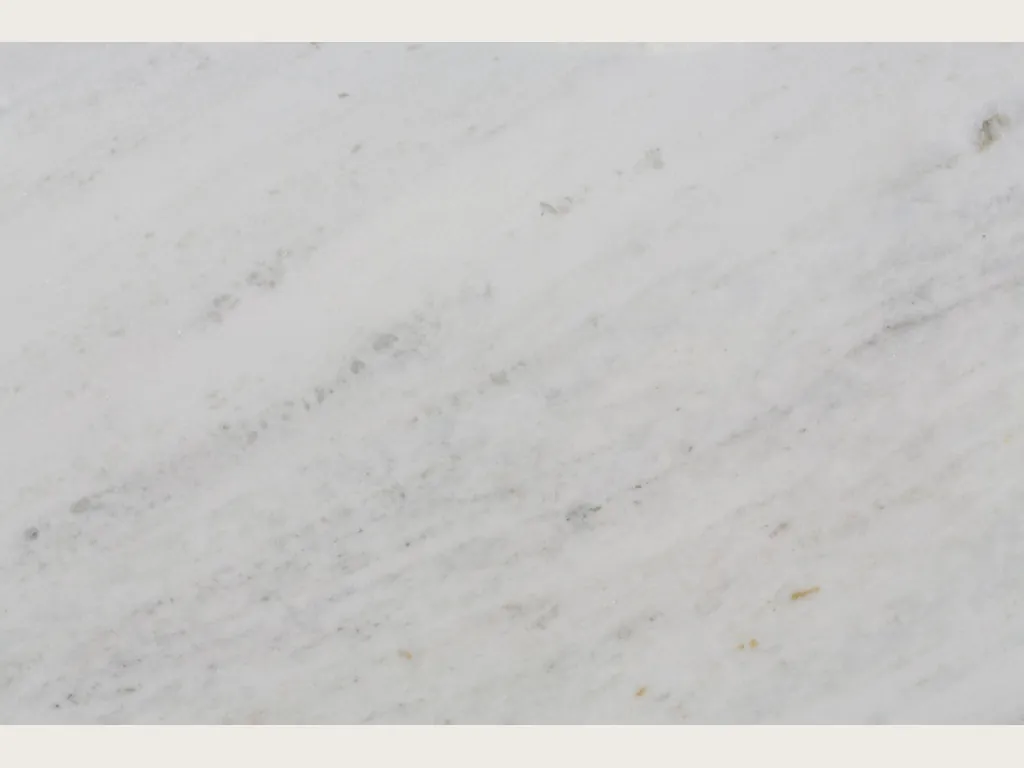Bianco Brasile marble slab: a grayish white background with very fine, faint gray veins on the diagonal