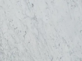 White Bianco Carrara C Extra marble detail: fine, diffuse gray strokes over the white background