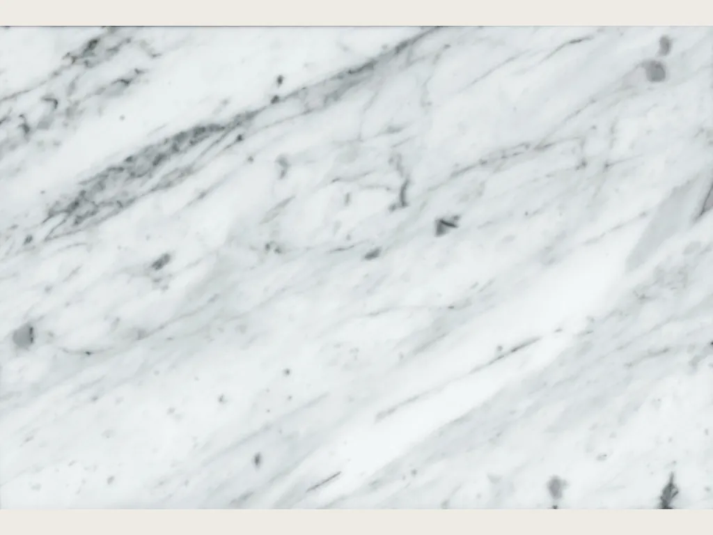 Slab of Bianco Gioia marble: white background with diagonal gray veins and a dark upper zone