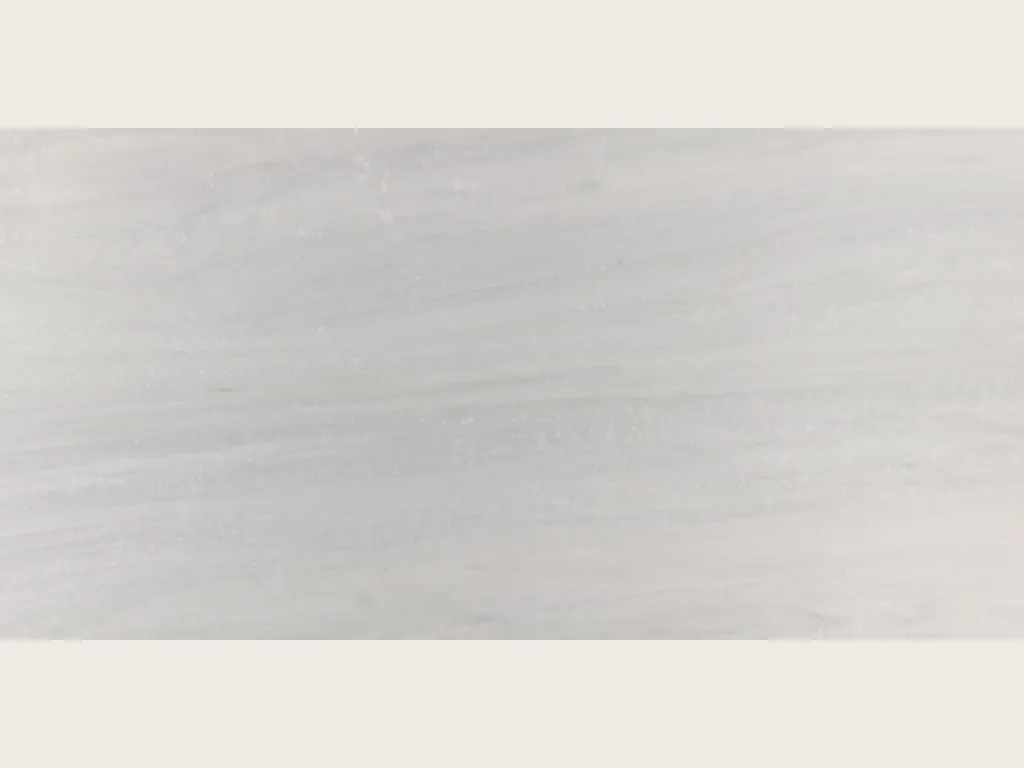 Reference photo of Bianco Laser marble: grayish white background with very faint horizontal gray lines