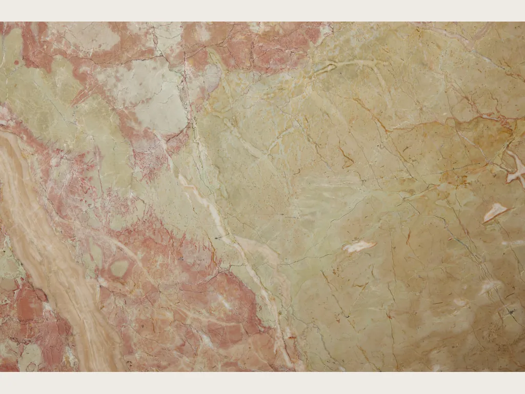 Slab of beige Breccia D'Aragona marble: greenish beige fragments with coral pink patches and fine light veins