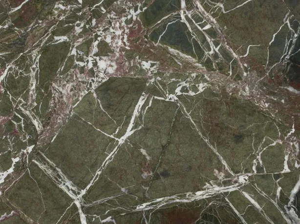 Close-up of Breccia Imperiale green marble: straight white veins, wine-red touches and a polished shine