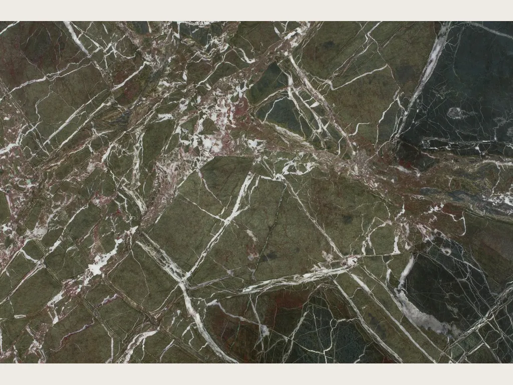 Slab of Breccia Imperiale green marble: a web of thin white veins and wine-red touches over the dark green