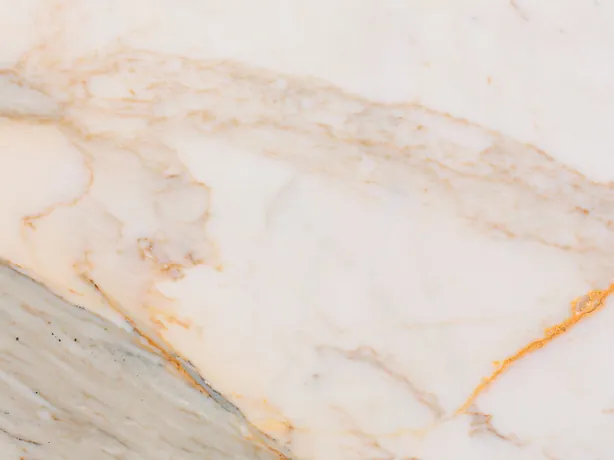 Detail of Calacatta Macchia Vecchia: fine golden veins over the warm white