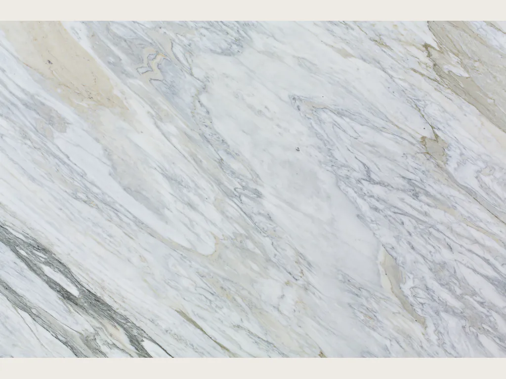 Slab of white Calacatta Manhattan marble: white background with fine, wavy gray veins on the diagonal