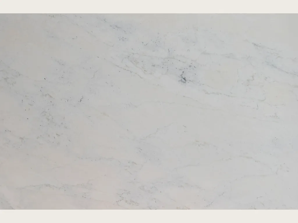 Slab of white Calacatta Michelangelo marble: grayish white background with very faint gray veins