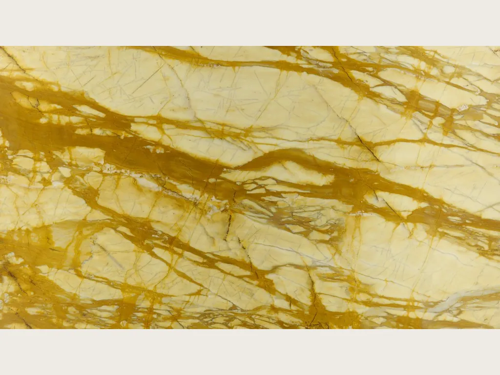 Golden Calacatta Siena marble slab: pale yellow background with a dense web of golden ochre veins running horizontally