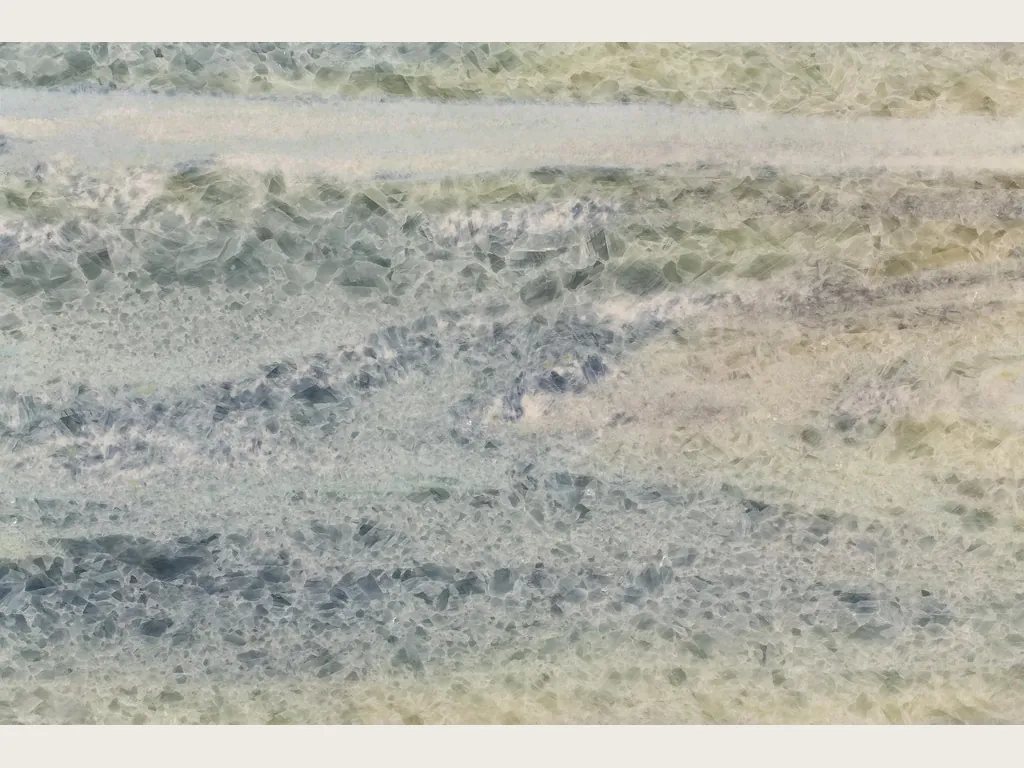 Slab of blue Calcite Caraibica marble: horizontal bands of crystals in blue-grey, sage green and beige