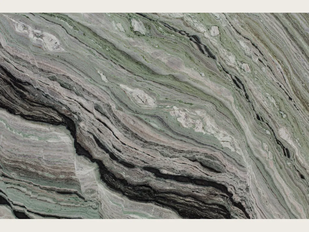 Slab of green Camellia Green marble: fine wavy diagonal bands and a marked black band at the base