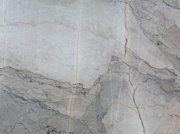 Close-up of gray Camouflage marble: fine light and dark veins around gray fragments