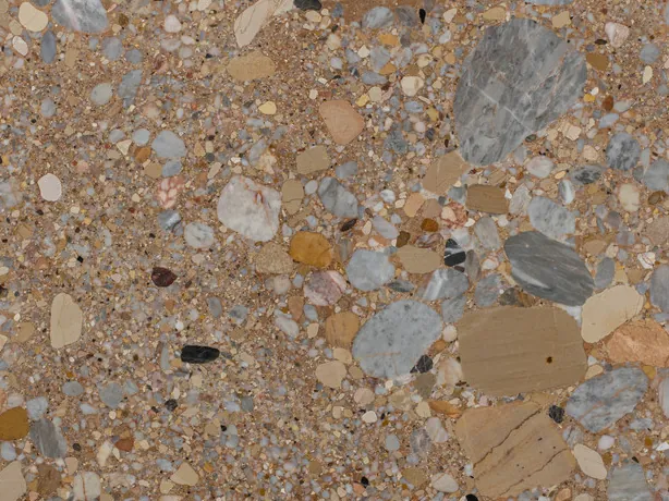 Ceppo Rosso detail: the rounded edges of the bluish gray and beige pebbles