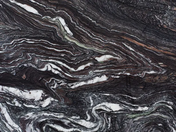 Detail of Cipollino Ondulato Marble: folds of white veins over the purple background