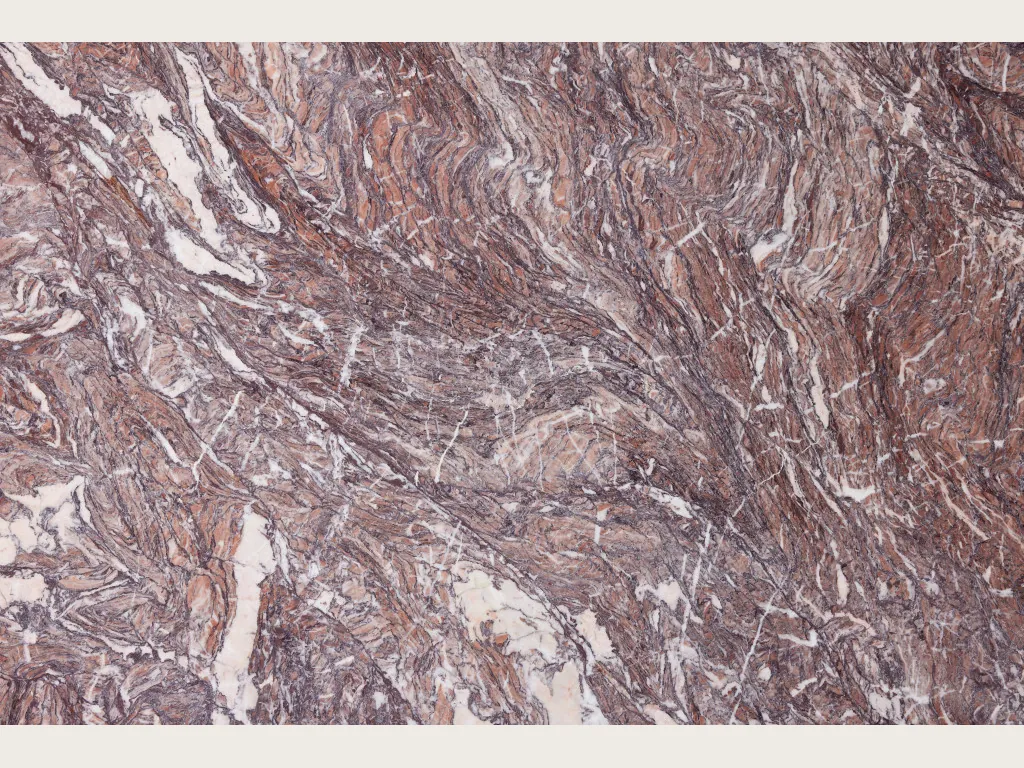 Slab of Cipollino Viola marble: reddish violet background with fine folds and white veins on the diagonal