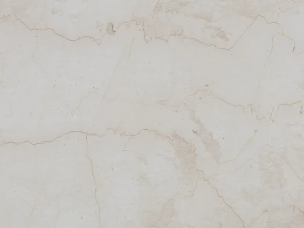 Cremo Italia detail: a fine, irregular beige vein over the light cream