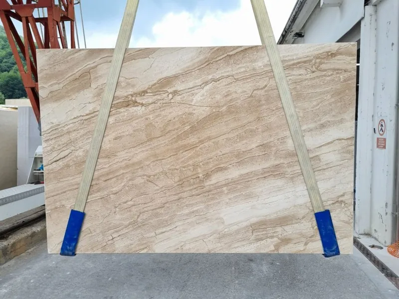 Slab of beige Daino Reale marble: beige background with fine brown and cream veins, parallel and diagonal