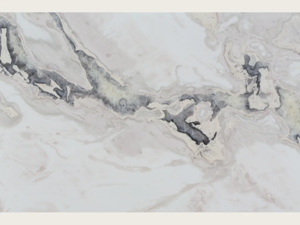 Dover White marble slab: white background with an irregular dark gray vein running horizontally and soft beige waves