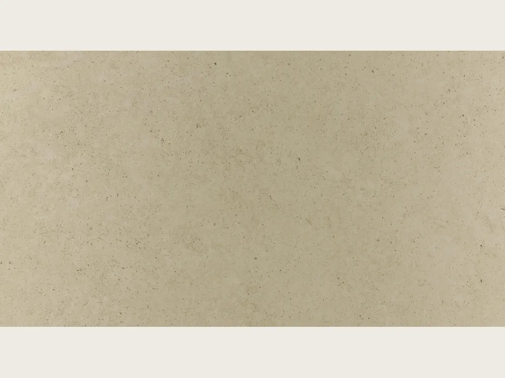 Reference photo of Gascogne Beige Marble: a smooth greenish beige background with tiny dark specks and a matte surface