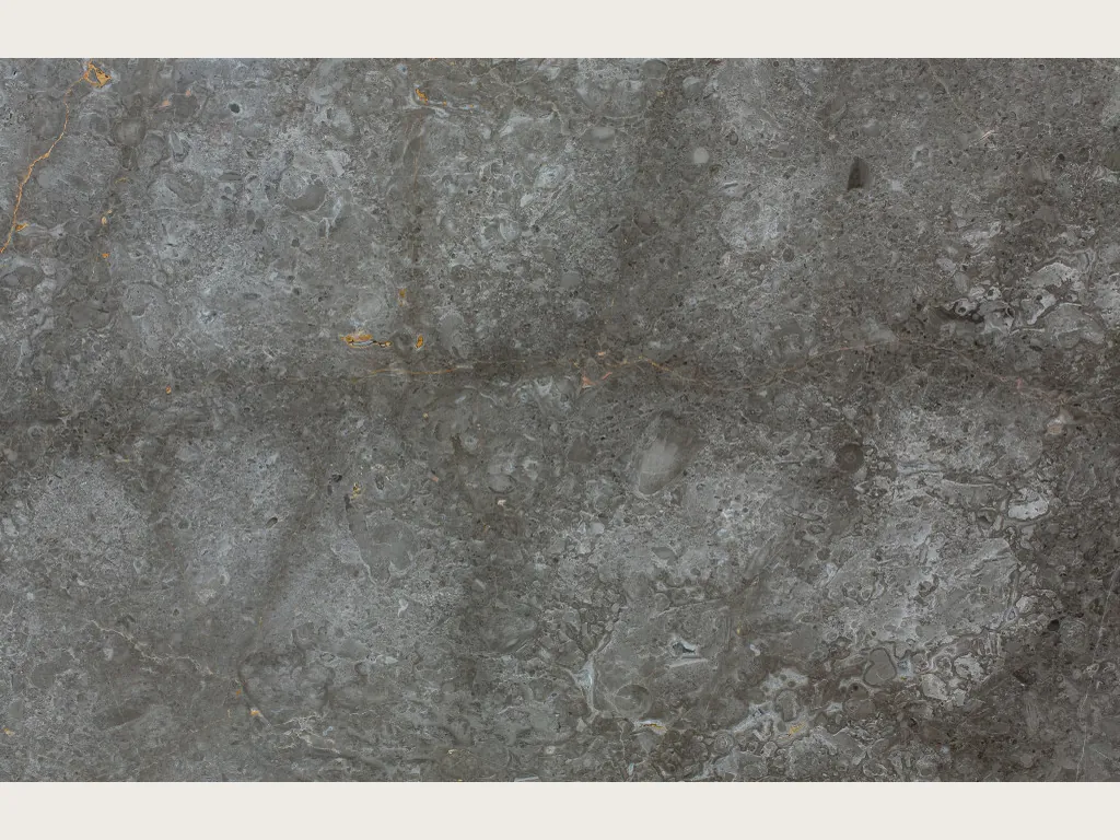 Grigio Billiemi marble slab: medium gray background with light clouds and a horizontal dark band