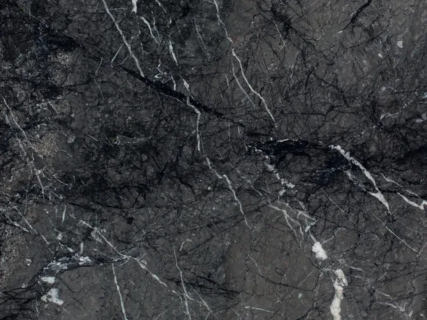 Detail of black Grigio Carnico marble: fine, crisp white veins over the high-gloss polish