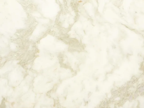 White Jasmine marble detail: wide, diffuse beige veins over the warm white background