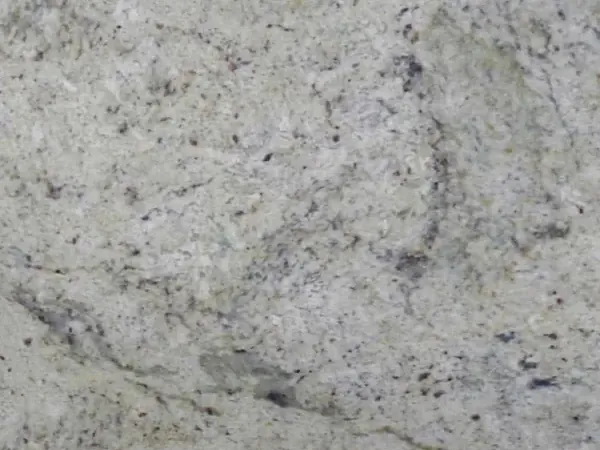 Slab of Lemon Ice marble: a mottled light gray background with dark flecks and a darker wavy band