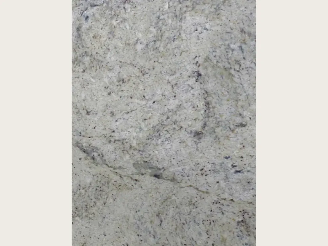 Slab of gray Lemon Ice marble: a mottled light gray background with dark flecks and a darker wavy band