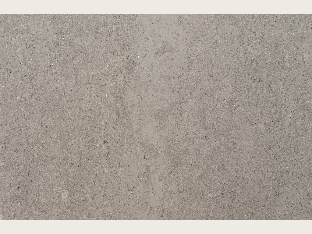 Slab of gray Lipica Unito marble: even, fine-grained beige gray with no veins