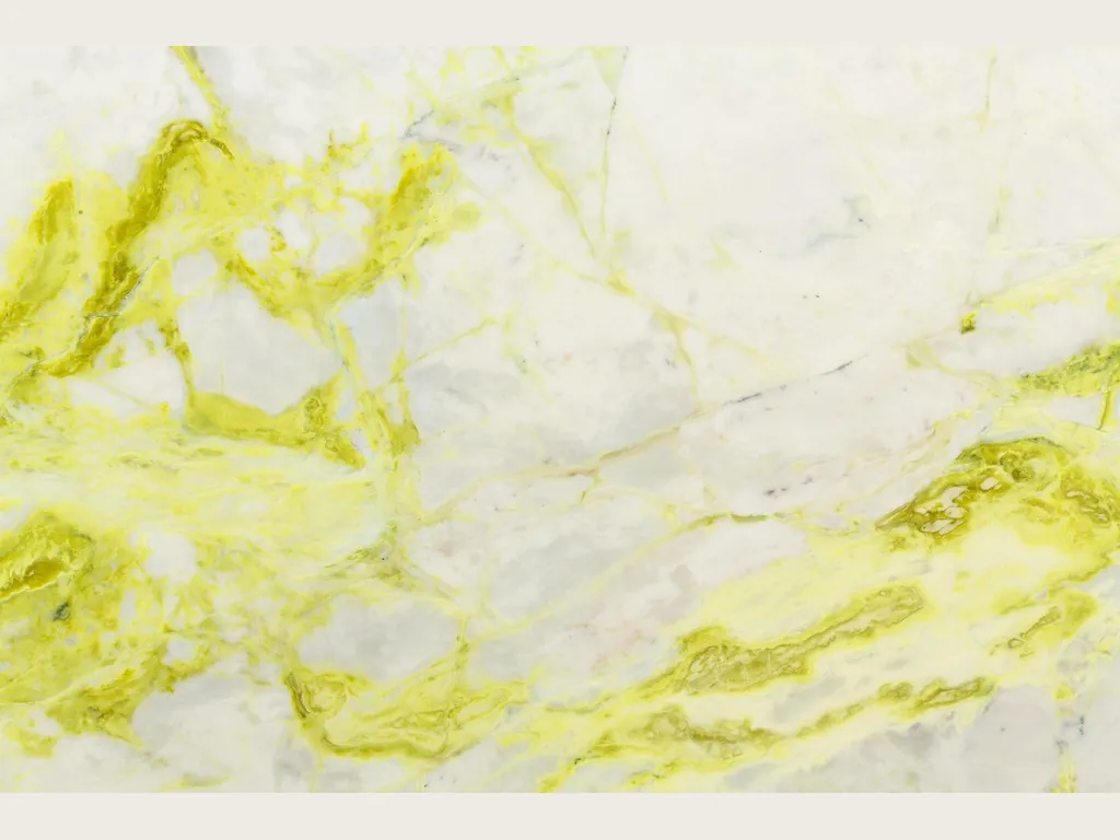 Slab of white Luminous marble: bluish white background with wide, irregular lemon yellow veins