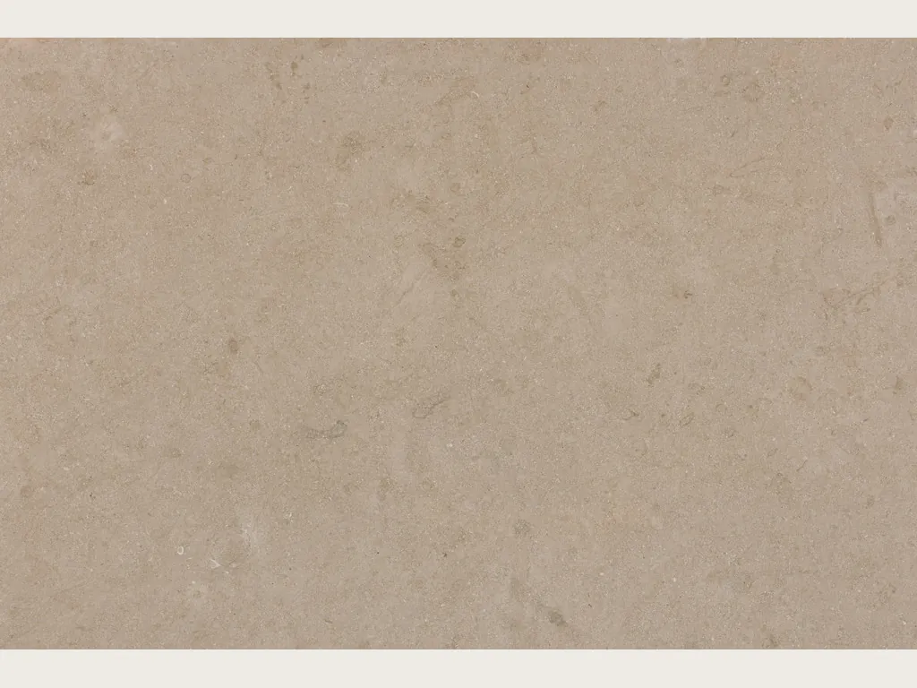 Avorio marble slab: a nearly smooth warm beige background, vein-free, with very faint tonal clouds