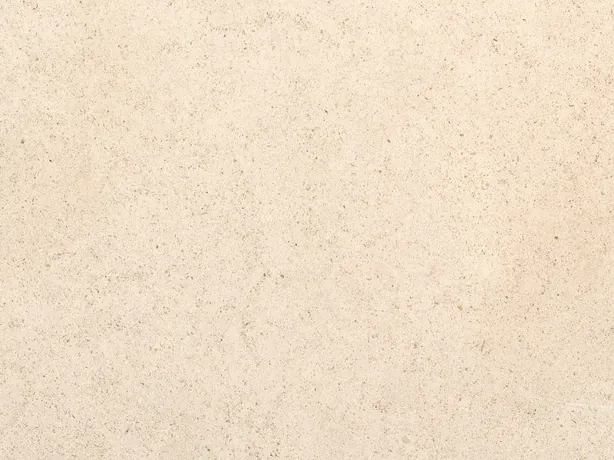 Close-up of beige Masai marble: the tiny specks of the fine grain over the pinkish cream