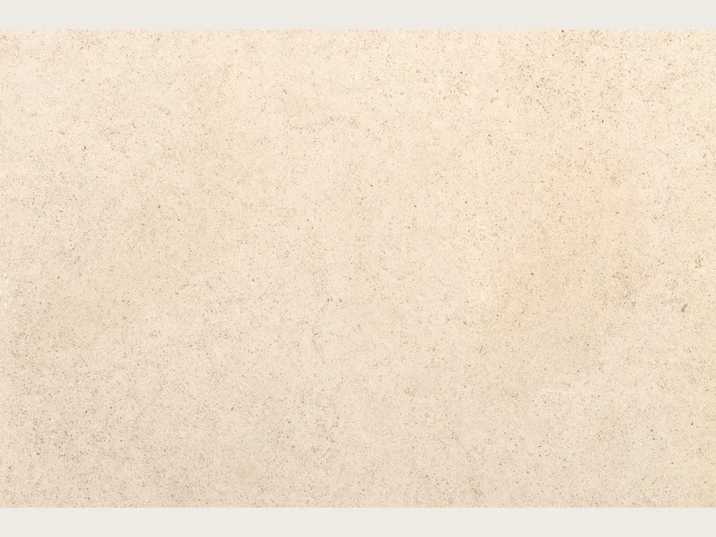 Beige Masai marble slab: an even pinkish cream background, fine grain with tiny specks and a matte surface