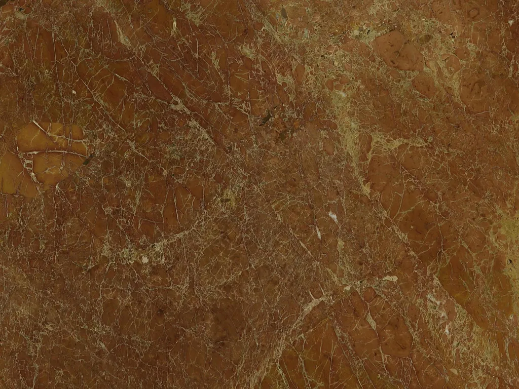 Red Melograno marble slab: brick red with a fine network of cream veins and diffuse ochre patches