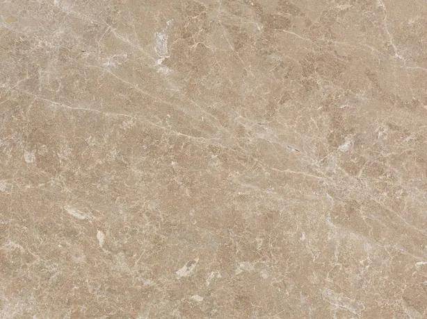 Close-up of beige Monaco Light marble: fine cream veins over the polished pinkish beige