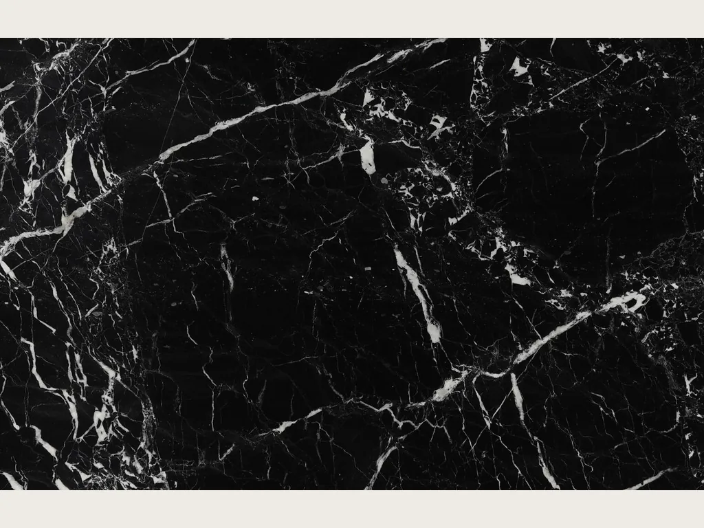 Slab of black Napoleon Black marble: a deep black background with an irregular network of white veins