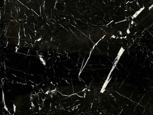 Nero Marquina marble slab: deep black background with a few fine straight white veins on the diagonal