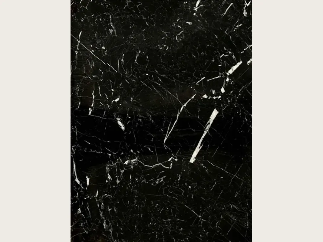 Slab of black Nero Marquina marble: deep black background with a few fine straight white veins on the diagonal