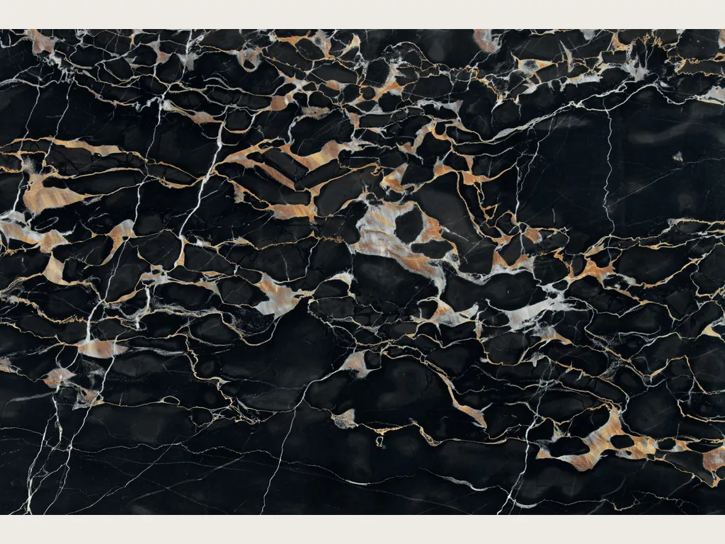 Slab of black Nero Portoro marble: deep black background with a dense web of gold and white veins