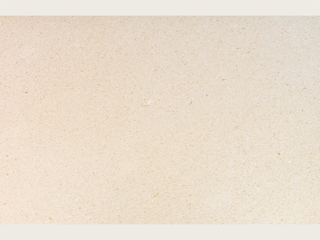 Slab of New Marfil marble: uniform light cream, fine-grained and vein-free, in a matte finish