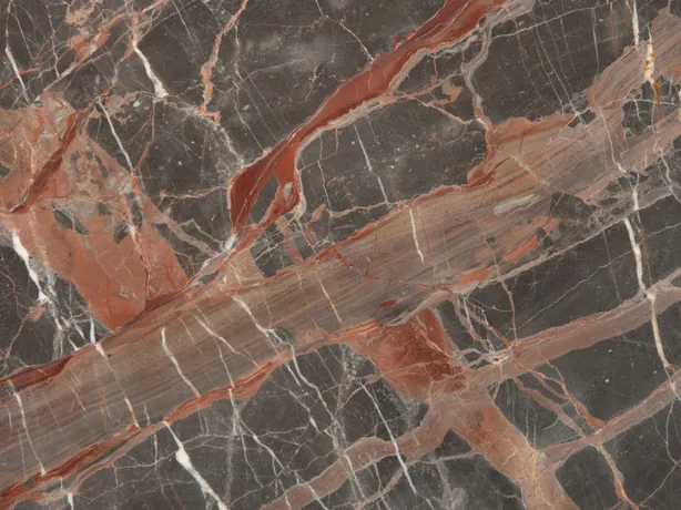 Detail of the brown Ombra di Caravaggio marble: terracotta and white veins crossing over the polished background
