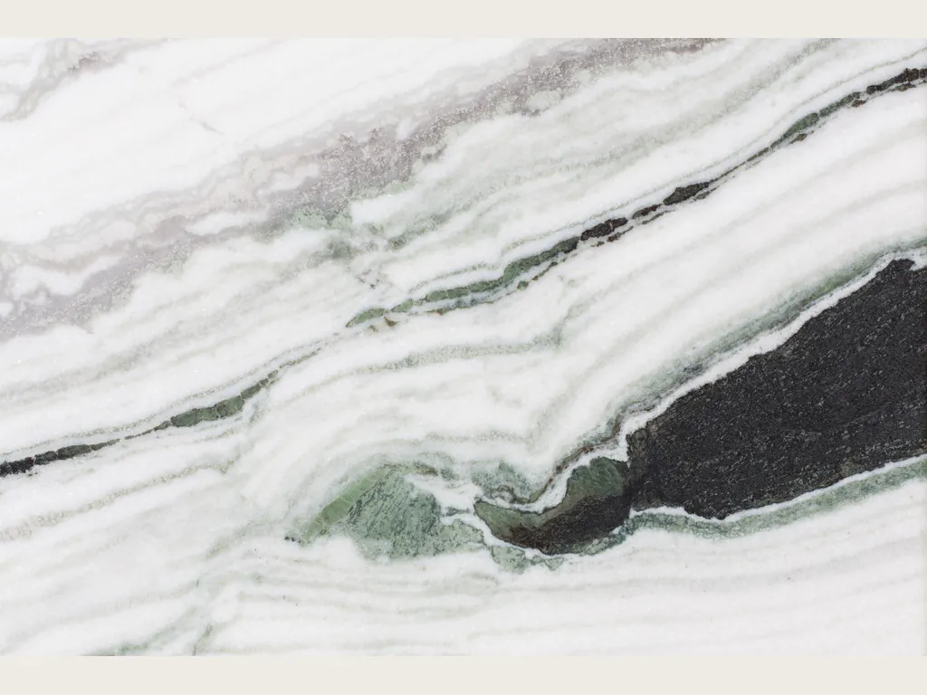 Panda White marble slab: white background with thick black and gray bands on the diagonal and green touches