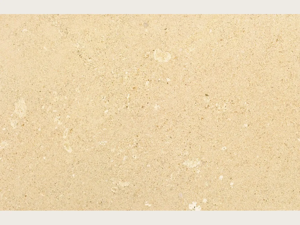 Slab of Pietra di Vicenza Bianca marble: sandy beige with visible grain, small light fragments and no veins