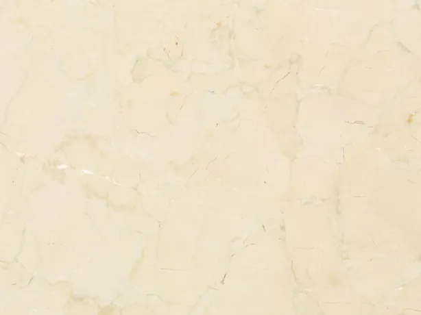 Detail of beige Pietra Orsera marble: a soft web of beige veins over the light cream background