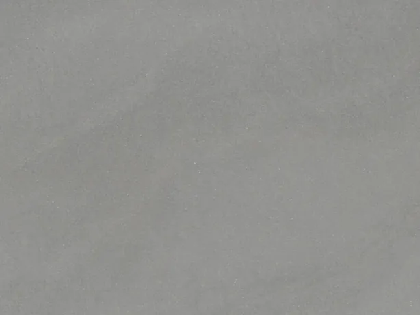 Detail of the Pietra Serena slab: the matte of the medium gray and its faint tonal clouds.