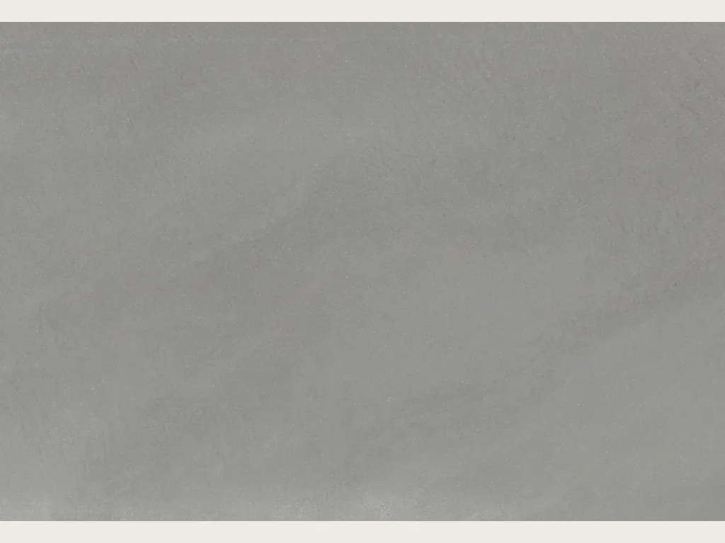 Gray Pietra Serena marble slab: smooth, even medium gray with no veins, in full view.