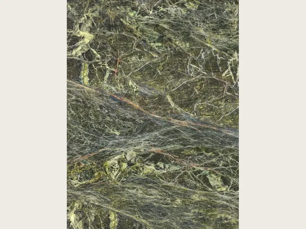 Rainforest Green marble slab: dark green with a dense web of yellow-green and reddish veins