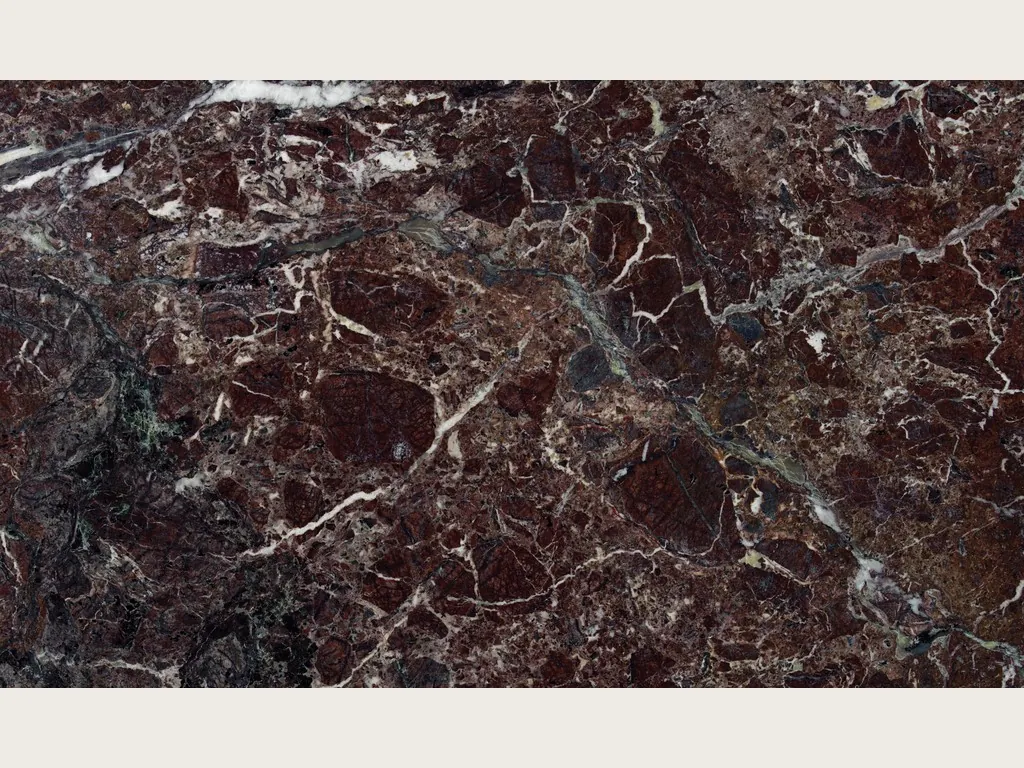 Slab of red Rosso Levanto marble: brecciated dark burgundy background with a network of white veins and gray-green areas