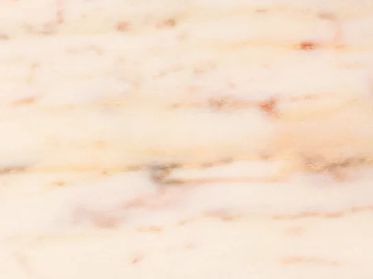 Detail of Rosa Portogallo marble: wavy reddish veins over the pale pink, in a glossy polish