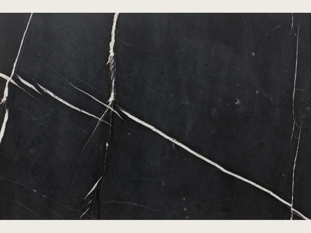 Slab of Sahara Noir black marble: brown-black background with very fine gold lines (another slab)